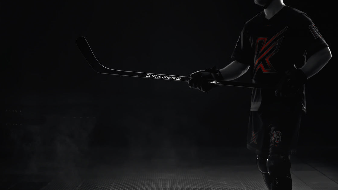 A collection of various composite ball hockey sticks.